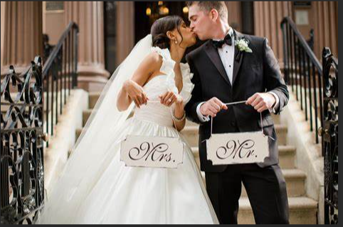 One Just married couple sharing a kiss